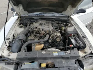 2004 Ford Mustang Deluxe z VIN 1FAFP44454F123067, wystawiony jako Copart lot #86784474 z przebiegiem 161 541 mil mil oraz Szkoda całkowita • Salvage title. Historia ofert i sprzedaży dostępna na DreamBid. Obrazek 11.