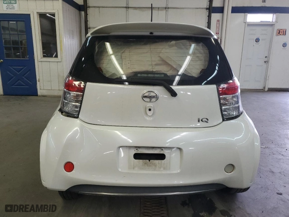 2012 Scion iQ with VIN JTNJJXB02CJ011910, listed as a Copart auction lot 77388604 with 0 mi miles and Salvage Title. Bid and sale history available at carsss.com. Image 6.