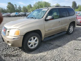 2005 GMC Envoy SLT with VIN 1GKDS13S552135280, listed as a Copart auction lot 68097344 with 165,924 mi miles and Salvage Title. Bid and sale history available at carsss.com. Image 1.