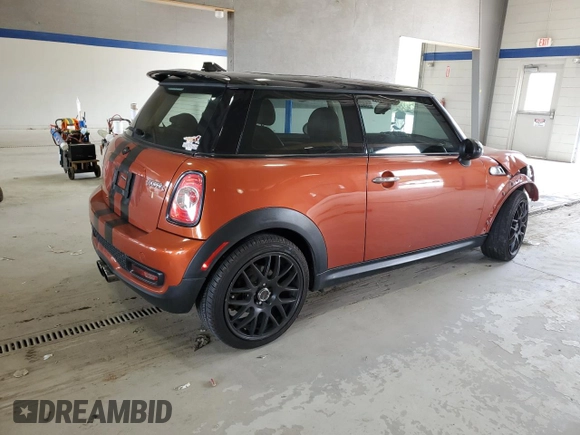 2013 MINI Hardtop S with VIN WMWSV3C52DT396176, listed as a Copart auction lot 59207165 with 104,194 mi miles and Salvage title. Bid and sale history available at DreamBid. Image 3.