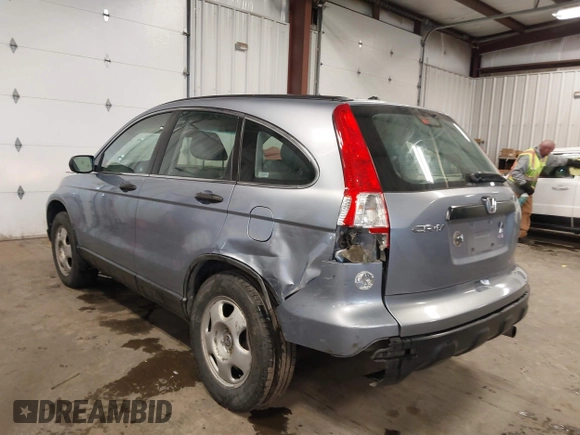2009 Honda CR-V LX with VIN JHLRE48359C018488, listed as a IAAI auction lot 41824887 with 203,235 mi miles. Bid and sale history available at carsss.com. Image 3.