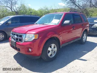2010 Ford Escape XLT with VIN 1FMCU0D75AKB11394, listed as a IAAI auction lot 42037996 with 150,815 mi miles. Bid and sale history available at carsss.com. Image 2.