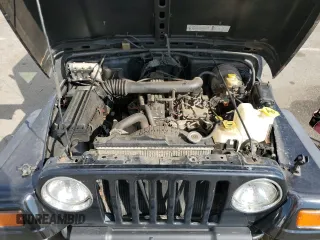 1999 Jeep Wrangler Sport z VIN 1J4FY19SXXP465037, wystawiony jako Copart lot #54772405 z przebiegiem 50 942 mil mil oraz Nie do naprawy • Non repairable. Historia ofert i sprzedaży dostępna na DreamBid. Obrazek 11.