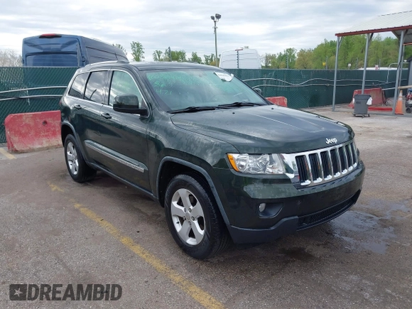 2011 Jeep Grand Cherokee 70th Anniversary with VIN 1J4RR4GG3BC631831, listed as a IAAI auction lot 42038415 with 130,811 mi miles. Bid and sale history available at carsss.com. Image 1.