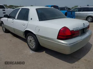 2004 Mercury Grand Marquis GS z VIN 2MEFM74W54X654116, wystawiony jako IAAI lot #41875021 z przebiegiem 129 999 mil mil oraz . Historia ofert i sprzedaży dostępna na DreamBid. Obrazek 3.