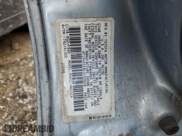 1990 Toyota Camry DLX z VIN 4T1SV21E8LU165609, wystawiony jako Copart lot #79314534 z przebiegiem 153 006 mil mil oraz Szkoda całkowita • Salvage title. Historia ofert i sprzedaży dostępna na DreamBid. Obrazek 12.