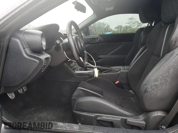 2022 Toyota GR86 Premium with VIN JF1ZNBE13N9757764, listed as a Copart auction lot 77310404 with 12,589 mi miles and Salvage Title. Bid and sale history available at carsss.com. Image 7.