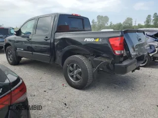2015 Nissan Titan Pro-4X with VIN 1N6BA0EC1FN507894, listed as a Copart auction lot 65784274 with 147,576 mi miles and Salvage title. Bid and sale history available at DreamBid. Image 2.