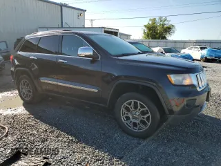 2013 Jeep Grand Cherokee Overland with VIN 1C4RJFCG2DC653207, listed as a Copart auction lot 48680885 with 276,020 mi miles and Salvage Title. Bid and sale history available at carsss.com. Image 4.