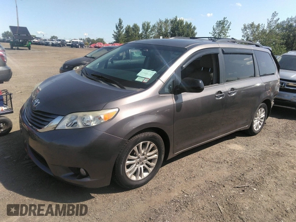 2014 Toyota Sienna XLE with VIN 5TDYK3DC2ES418860, listed as a IAAI auction lot 40139260 with 67,599 mi miles and . Bid and sale history available at DreamBid. Image 2.
