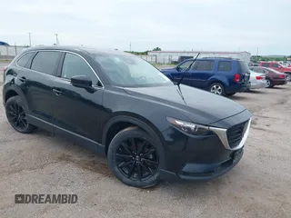 2023 Mazda CX-9 Touring Plus z VIN JM3TCBAY0P0656835, wystawiony jako IAAI lot #42707229 z przebiegiem 47 989 mil mil oraz . Historia ofert i sprzedaży dostępna na DreamBid. Obrazek 1.