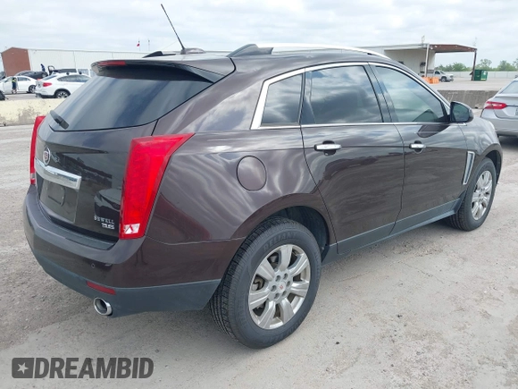 2015 Cadillac SRX Luxury Collection z VIN 3GYFNBE35FS597538, wystawiony jako IAAI lot #42056002 z przebiegiem 49 483 mil mil oraz . Historia ofert i sprzedaży dostępna na DreamBid. Obrazek 4.