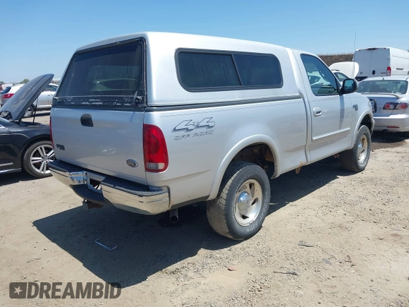 2000 Ford F-150 XL z VIN 1FTRF18L1YKA63179, wystawiony jako IAAI lot #42532771 z przebiegiem 116 604 mil mil oraz . Historia ofert i sprzedaży dostępna na DreamBid. Obrazek 4.