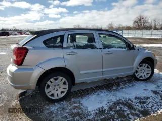 2010 Dodge Caliber SXT z VIN 1B3CB4HA4AD597158, wystawiony jako Copart lot #51757335 z przebiegiem 128 791 mil mil oraz Czysty tytuł • Clean title. Historia ofert i sprzedaży dostępna na DreamBid. Obrazek 3.
