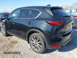 2021 Mazda CX-5 Grand Touring with VIN JM3KFBDM0M0468081, listed as a IAAI auction lot 41894411 with 54,664 mi miles. Bid and sale history available at carsss.com. Image 3.