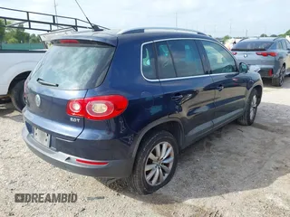 2011 Volkswagen Tiguan SE with VIN WVGAV7AX7BW530357, listed as a IAAI auction lot 42740821 with 170,636 mi miles and . Bid and sale history available at DreamBid. Image 4.