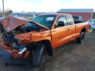 2000 Dodge Dakota SLT with VIN 1B7GG22XXYS610262, listed as a IAAI auction lot 41806744 with 243,650 mi miles and . Bid and sale history available at carsss.com. Image 2.