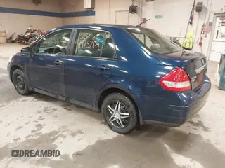 2009 Nissan Versa 1.8 S with VIN 3N1BC11E79L440560, listed as a IAAI auction lot 41975289 with 158,726 mi miles. Bid and sale history available at carsss.com. Image 3.