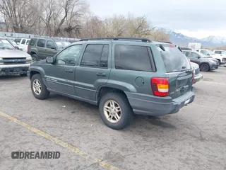 2003 Jeep Grand Cherokee Laredo with VIN 1J4GX48S03C536709, listed as a IAAI auction lot 41908946 with 240,435 mi miles. Bid and sale history available at carsss.com. Image 3.