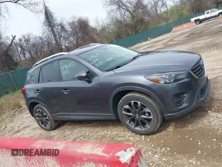 2016 Mazda CX-5 Grand Touring with VIN JM3KE4DYXG0830150, listed as a IAAI auction lot 41961007 with 142,570 mi miles and . Bid and sale history available at DreamBid. Image 13.