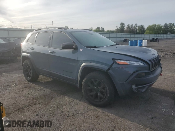 2014 Jeep Cherokee Trailhawk with VIN 1C4PJMBS3EW308706, listed as a Copart auction lot 58307975 with 90,530 mi miles and Salvage title. Bid and sale history available at DreamBid. Image 4.