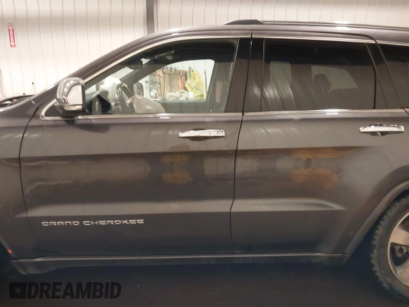2015 Jeep Grand Cherokee Overland z VIN 1C4RJFCG1FC663469, wystawiony jako IAAI lot #41666113 z przebiegiem 140 159 mil mil oraz . Historia ofert i sprzedaży dostępna na DreamBid. Obrazek 14.