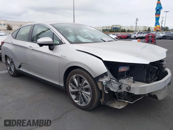 2018 Honda Clarity Touring with VIN JHMZC5F32JC014588, listed as a IAAI auction lot 42066633 with 89,316 mi miles. Bid and sale history available at carsss.com. Image 1.