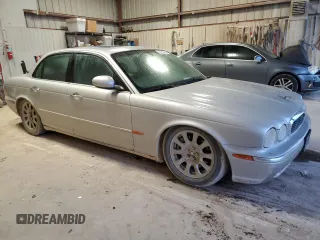 2004 Jaguar XJ with VIN SAJEA71C84SG07220, listed as a Copart auction lot 70916164 with 151,102 mi miles and Salvage Title. Bid and sale history available at carsss.com. Image 4.