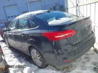 2015 Ford Focus Titanium with VIN 1FADP3J22FL323185, listed as a IAAI auction lot 41461154 with 125,477 mi miles and . Bid and sale history available at carsss.com. Image 3.