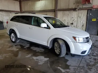 2017 Dodge Journey SXT with VIN 3C4PDCBG0HT572165, listed as a Copart auction lot 56673495 with Not provided miles and Salvage title. Bid and sale history available at DreamBid. Image 4.