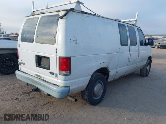 1999 Ford Econoline Cargo Commercial with VIN 1FTNE24L3XHB84868, listed as a IAAI auction lot 41151145 with 450,651 mi miles and . Bid and sale history available at carsss.com. Image 4.