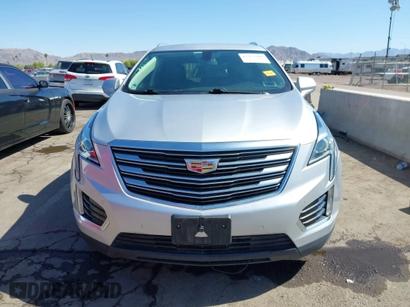 2017 Cadillac XT5 Luxury AWD z VIN 1GYKNDRS1HZ293429, wystawiony jako IAAI lot #42453704 z przebiegiem 92 347 mil mil oraz . Historia ofert i sprzedaży dostępna na DreamBid. Obrazek 12.