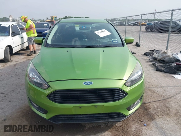 2018 Ford Focus SE z VIN 1FADP3FE5JL222542, wystawiony jako IAAI lot #42265608 z przebiegiem 107 397 mil mil oraz . Historia ofert i sprzedaży dostępna na DreamBid. Obrazek 12.