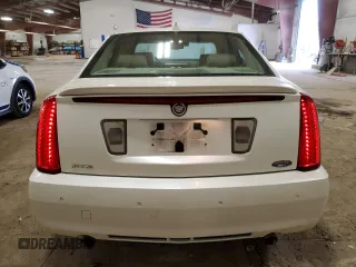 2010 Cadillac STS AWD z VIN 1G6DU6EV0A0106434, wystawiony jako Copart lot #52439915 z przebiegiem 90 187 mil mil oraz Czysty tytuł • Clean title. Historia ofert i sprzedaży dostępna na DreamBid. Obrazek 6.