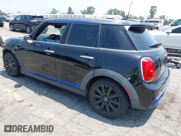 2015 MINI Hardtop 4 Door S with VIN WMWXU3C58F2B66601, listed as a IAAI auction lot 42444404 with 76,174 mi miles and . Bid and sale history available at DreamBid. Image 3.