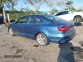 2016 Volkswagen Jetta Sedan 1.4T SE with VIN 3VWD67AJ0GM328412, listed as a IAAI auction lot 41556254 with 137,814 mi miles. Bid and sale history available at carsss.com. Image 3.