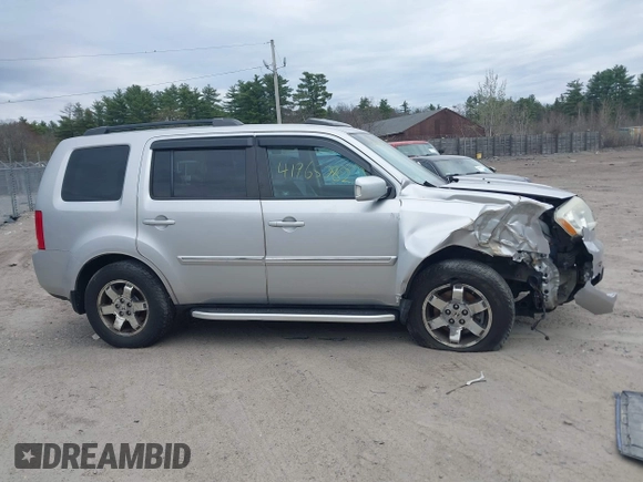 2011 Honda Pilot Touring with VIN 5FNYF4H90BB022354, listed as a IAAI auction lot 41965082 with 126,505 mi miles and . Bid and sale history available at carsss.com. Image 14.