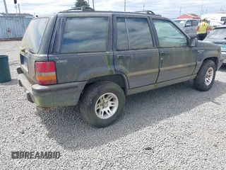 1994 Jeep Grand Cherokee Laredo z VIN 1J4GZ58Y2RC320793, wystawiony jako IAAI lot #42781115 z przebiegiem 275 518 mil mil oraz . Historia ofert i sprzedaży dostępna na DreamBid. Obrazek 4.