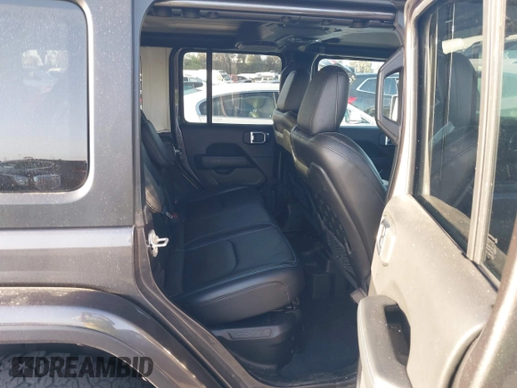 2023 Jeep Wrangler Rubicon with VIN 1C4JJXR67PW662277, listed as a IAAI auction lot 41950065 with 35,714 mi miles and . Bid and sale history available at DreamBid. Image 8.