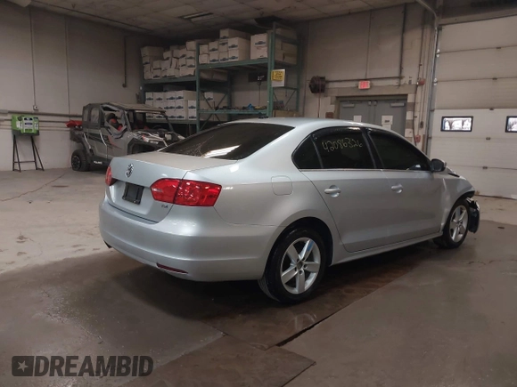 2014 Volkswagen Jetta TDI w/Premium with VIN 3VW3L7AJ6EM379401, listed as a IAAI auction lot 42086326 with 89,870 mi miles and . Bid and sale history available at DreamBid. Image 4.