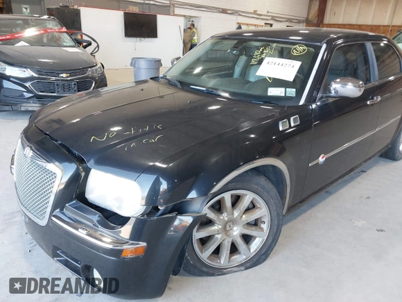 2006 Chrysler 300 C with VIN 2C3KA63H06H421414, listed as a IAAI auction lot 42144274 with 118,692 mi miles. Bid and sale history available at carsss.com. Image 12.