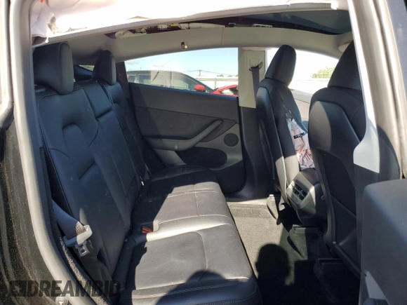2023 Tesla Model Y Long Range z VIN 7SAYGDEE1PF865195, wystawiony jako Copart lot #57455765 z przebiegiem 32 011 mil mil oraz Szkoda całkowita • Salvage title. Historia ofert i sprzedaży dostępna na DreamBid. Obrazek 11.