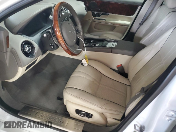 2016 Jaguar XJ R-Sport with VIN SAJWJ1CDXG8W00145, listed as a Copart auction lot 49901234 with 76,629 mi miles and . Bid and sale history available at DreamBid. Image 7.