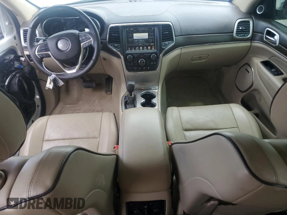 2017 Jeep Grand Cherokee Overland with VIN 1C4RJFCT7HC734125, listed as a Copart auction lot 54333215 with 101,229 mi miles and Salvage title. Bid and sale history available at DreamBid. Image 8.