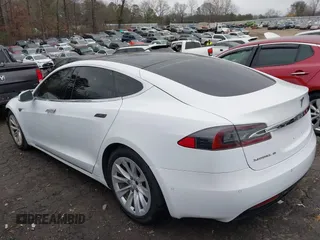 2016 Tesla Model S 90D with VIN 5YJSA1E26GF155962, listed as a IAAI auction lot 41348998 with 134,269 mi miles and . Bid and sale history available at DreamBid. Image 3.