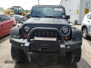 2013 Jeep Wrangler Unlimited Rubicon 10th Anniversary with VIN 1C4HJWFGXDL543660, listed as a Copart auction lot 61462104 with 115,897 mi miles and Salvage title. Bid and sale history available at DreamBid. Image 5.
