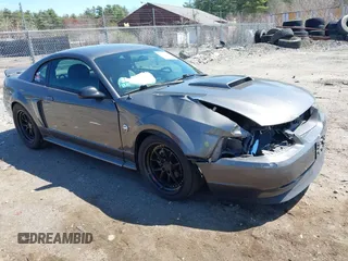 2004 Ford Mustang GT Deluxe z VIN 1FAFP42X44F142786, wystawiony jako IAAI lot #42095619 z przebiegiem 100 020 mil mil oraz . Historia ofert i sprzedaży dostępna na DreamBid. Obrazek 1.