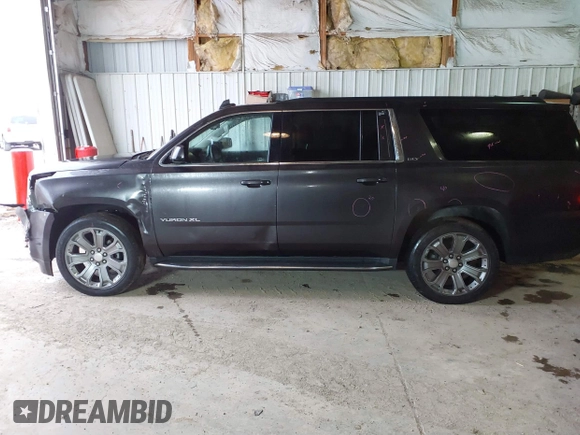 2015 GMC Yukon XL SLT with VIN 1GKS2HKC6FR667110, listed as a IAAI auction lot 41472250 with 141,383 mi miles. Bid and sale history available at carsss.com. Image 14.