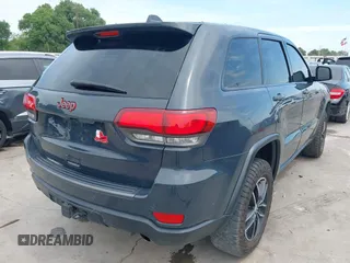 2017 Jeep Grand Cherokee Trailhawk with VIN 1C4RJFLG4HC843628, listed as a IAAI auction lot 42053878 with 83,551 mi miles and . Bid and sale history available at DreamBid. Image 4.