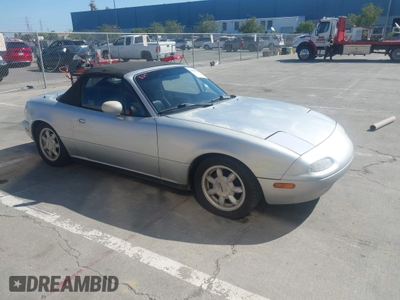 1991 Mazda MX-5 Miata Special Edition z VIN JM1NA3511M1235948, wystawiony jako IAAI lot #42322754 z przebiegiem 151 065 mil mil oraz . Historia ofert i sprzedaży dostępna na DreamBid. Obrazek 1.